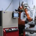 Brilliant high power diode laser LDF with a robot application in the background by Laserline diode lasers